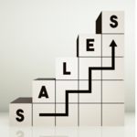 White blocks arranged like a rising bar graph spelling out "SALES" with a black stepped arrow line pointing upward toward the top.