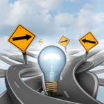 A glowing light bulb standing at a complex intersection of winding roads surrounded by yellow diamond directional signs pointing in different directions.